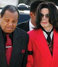 Joseph “Joe” Jackson, patriarch of the famous musical family that bears his name, died on Wednesday, June 27, at age 89. He’s shown here in 2005 with his superstar son, Michael, who died in June 2009.