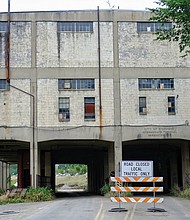 View of the warehouse in the East End that was once a centerpiece of Richmond's efforts to create a bustling commercial port at Intermediate Terminal on Water Street along the James River.
