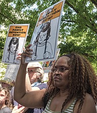 RALLYING FOR JUSTICE-
Andrea Miller joins protesters  during the “Families Belong Together Rally” at the Virginia State Capitol Bell Tower on Saturday, June 30.  Similar protests continue throughout the country in response to the Trump administration’s policy of separating immigrant parents and children entering the United States from Mexico.
