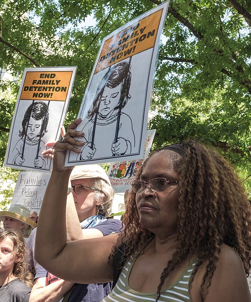 RALLYING FOR JUSTICE-
Andrea Miller joins protesters  during the “Families Belong Together Rally” at the Virginia State Capitol Bell Tower on Saturday, June 30.  Similar protests continue throughout the country in response to the Trump administration’s policy of separating immigrant parents and children entering the United States from Mexico.
