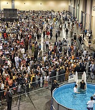 Followers pool together for convention-Thousands of Jehovah’s Witnesses gather at the Greater Richmond Convention Center in Downtown for last weekend’s convention. Religious followers from Virginia, North Carolina, Maryland, Washington and Delaware have been attending the series of three-day conventions in Richmond that will run each weekend through Aug. 5. The theme: “Be Courageous!”