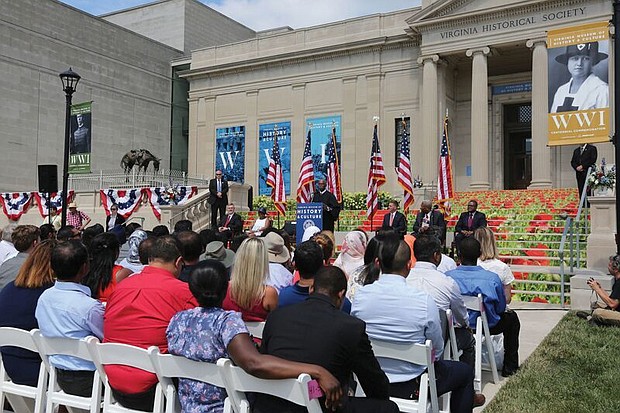 New citizens-
At the podium, Judge Roger L. Gregory, chief judge of the 4th U.S. Circuit Court of Appeals in Richmond, talks to 96 immigrants and their family members during the Fourth of July naturalization ceremony where they officially became U.S. citizens. The ceremony was held outside the Virginia Museum of History and Culture on the Boulevard. 