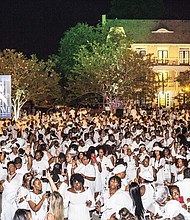 Dîner en Blanc Richmond 2018/
About 1,200 people enjoy the pop-up Dîner en Blanc event last Saturday at the Virginia Museum of History and Culture on the Boulevard. Participants, who dress in white, must bring their own table, chairs and food to a designated point, where they are transported to a secret location for dinner and music. The event began about 30 years ago in France and is held annually in cities across the globe. This was the second such event held in Richmond.