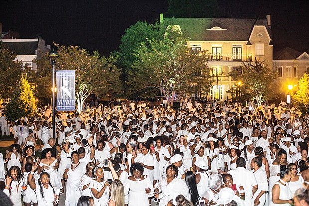 Dîner en Blanc Richmond 2018/
About 1,200 people enjoy the pop-up Dîner en Blanc event last Saturday at the Virginia Museum of History and Culture on the Boulevard. Participants, who dress in white, must bring their own table, chairs and food to a designated point, where they are transported to a secret location for dinner and music. The event began about 30 years ago in France and is held annually in cities across the globe. This was the second such event held in Richmond.