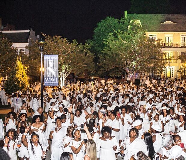 Dîner en Blanc Richmond 2018/
About 1,200 people enjoy the pop-up Dîner en Blanc event last Saturday at the Virginia Museum of History and Culture on the Boulevard. Participants, who dress in white, must bring their own table, chairs and food to a designated point, where they are transported to a secret location for dinner and music. The event began about 30 years ago in France and is held annually in cities across the globe. This was the second such event held in Richmond.