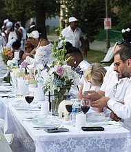 Dîner en Blanc Richmond 2018/
About 1,200 people enjoy the pop-up Dîner en Blanc event last Saturday at the Virginia Museum of History and Culture on the Boulevard. Participants, who dress in white, must bring their own table, chairs and food to a designated point, where they are transported to a secret location for dinner and music. The event began about 30 years ago in France and is held annually in cities across the globe. This was the second such event held in Richmond.