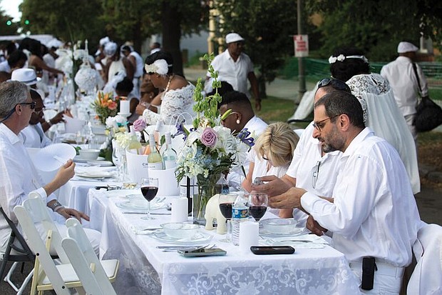 Dîner en Blanc Richmond 2018/
About 1,200 people enjoy the pop-up Dîner en Blanc event last Saturday at the Virginia Museum of History and Culture on the Boulevard. Participants, who dress in white, must bring their own table, chairs and food to a designated point, where they are transported to a secret location for dinner and music. The event began about 30 years ago in France and is held annually in cities across the globe. This was the second such event held in Richmond.