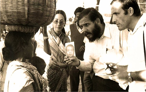 Dr. Larry Brilliant, center, here in India, helped to eradicate smallpox. The disease was declared extinct in 1980.