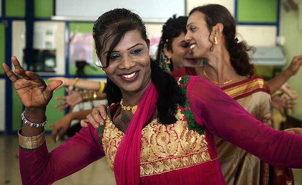 An Indian transgender resident dances with others at an event to celebrate a Supreme Court judgement in 2014. India's highest court ruled that a person can be legally recognized as gender-neutral.