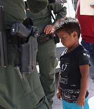 A Honduran boy and father seeking asylum in the US were taken into custody by US Border Patrol in June.