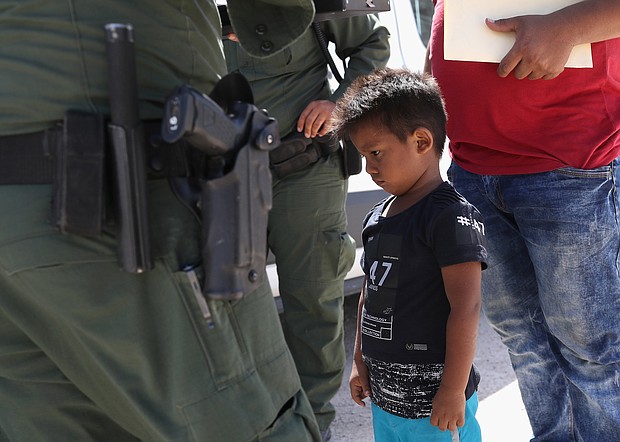 A Honduran boy and father seeking asylum in the US were taken into custody by US Border Patrol in June.