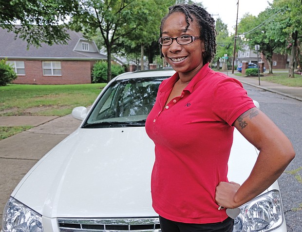 Kiocia Wilkerson of South Side is happy and proud about the 2002 Kia Optima that was presented to her by David L. Williams Jr. and the DLW Veterans Outreach and Training Center during the spring.  
