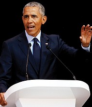 Former President Barack Obama delivers the 16th annual Nelson Mandela Lecture in Johannesburg Tuesday during that nation’s celebration of the 100th birthday of the late anti-apartheid leader and former South Africa president. 