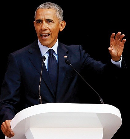 Former President Barack Obama delivers the 16th annual Nelson Mandela Lecture in Johannesburg Tuesday during that nation’s celebration of the 100th birthday of the late anti-apartheid leader and former South Africa president. 