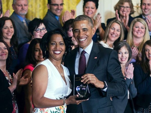 Jahana Hayes, left, a high school history teacher from Waterbury, CT, celebrates winning the 2016 National Teacher of the Year with President Barack Obama at the White House in Washington, May 3, 2016. (Jim Watson/AFP/Getty Images)