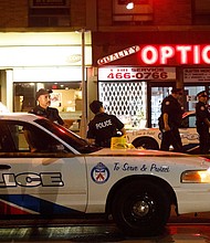 A woman was killed and 13 others injured in a shooting in Toronto on Sunday night, Police Chief Mark Saunders said.
