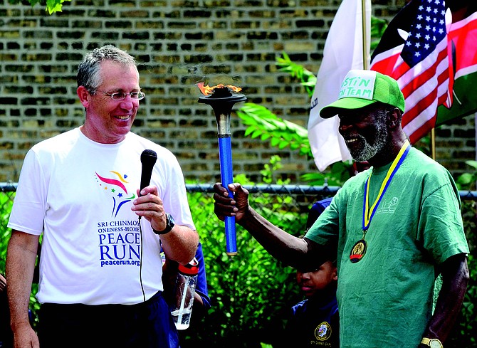 Longtime Austin resident and community activist, George Lawson, was recently awarded the 2018 Torch-Bearer Award from Sri Chinmoy Oneness-Home Peace Run due to his commitment to community
service for over 50 years. Photo Credit: Austin Green Team