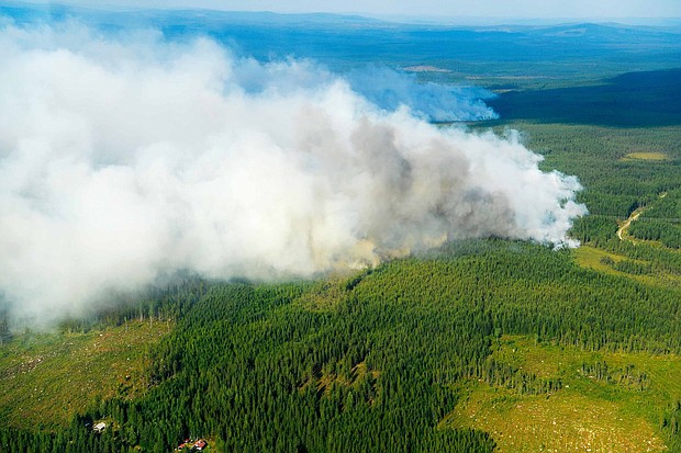 An aerial image shows forest fires burning Wednesda near Ljusdal, Sweden.