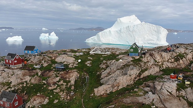 An 11-million-ton iceberg is threatening the isolated fishing village of Innaarsuit, Greenland.