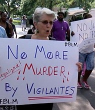 Hundreds marched with the family of the man fatally shot over a parking spot. Pinellas County Sheriff Bob Gualtieri says the shooting was justified under Florida's "Stand Your Ground" law.