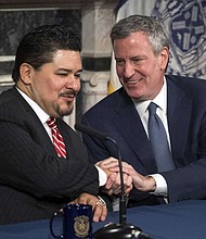 Richard A. Carranza and New York Mayor Bill de Blasio/AP Photo