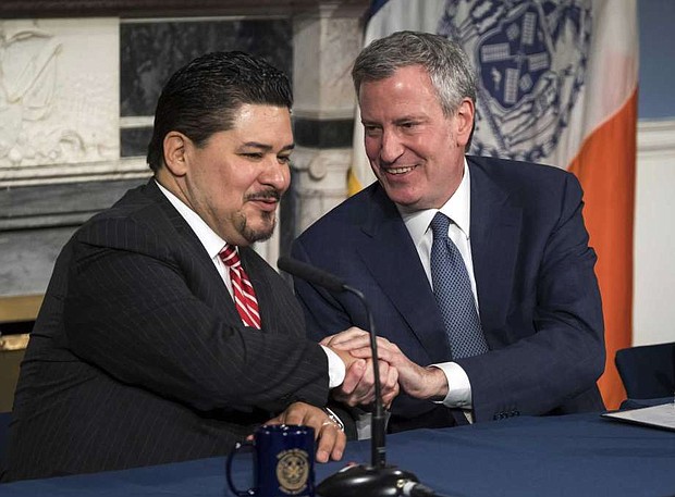 Richard A. Carranza and New York Mayor Bill de Blasio/AP Photo