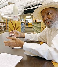 Civil rights figure James Meredith, 85, talks with a news reporter in late June about his plans to visit all 82 Mississippi counties and preach about the Ten Commandments.