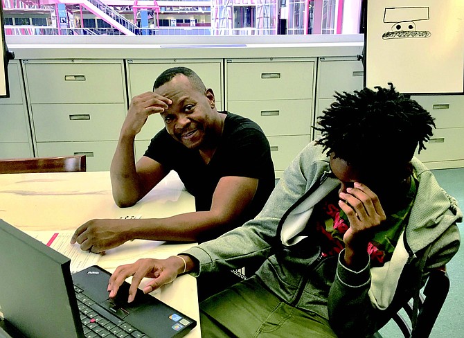 The Network For Teaching Entrepreneurship (NFTE) recently concluded their Summer BizCamp for Chicago’s youth. During the 2-week program NFTE Teacher Danny Gray, left, worked with students like Romer Flowers, right, to help them activate their entrepreneurial mindset. Photo Credit: Roha Nehas