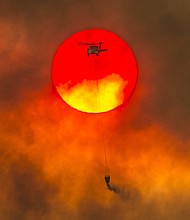 The catastrophic Carr fire blazed a path of devastation, becoming the 7th most destructive fire in California history as it burned more than 1,100 structures and left six people dead./Hector Amezcua/AP