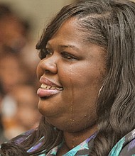 Kiwana Yates, the ousted principal of Carver Elementary School, sheds a tear during a March 2015 school assembly for winning a R.E.B. Award for Distinguished Educational Leadership. The award, given in partnership with The Community Foundation, came with a $15,000 prize. Half was for her personal use. The other half, she said at the time, would be used for educational field trips.