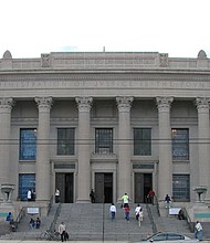 Carvings on the Orleans Parish Courthouse read: THE IMPARTIAL ADMINISTRATION OF JUSTICE IS THE FOUNDATION OF LIBERTY. (Photo by Seth Gaines)