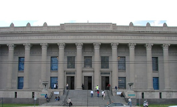 Carvings on the Orleans Parish Courthouse read: THE IMPARTIAL ADMINISTRATION OF JUSTICE IS THE FOUNDATION OF LIBERTY. (Photo by Seth Gaines)