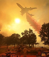 Catastrophic wildfires continue to ravage California, as one blaze nearly doubled in size over the weekend to make it the fourth largest in the state's history.
