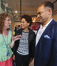 Marlene Paul, left, ART 180’s co-founder and executive director, greets Melody Barnes, former White House domestic policy adviser, and her husband, Marlon Buckner Jr., at the opening of ART180's 20th anniversary exhibit last Friday at the organization’s Atlas Galley, 114 W. Marshall St. Work from the exhibit, titled “Twenty: ART 180 Takes the Bus,” will spend most of August touring the city on GRTC buses.