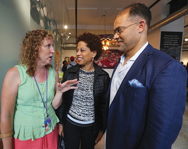 Marlene Paul, left, ART 180’s co-founder and executive director, greets Melody Barnes, former White House domestic policy adviser, and her husband, Marlon Buckner Jr., at the opening of ART180's 20th anniversary exhibit last Friday at the organization’s Atlas Galley, 114 W. Marshall St. Work from the exhibit, titled “Twenty: ART 180 Takes the Bus,” will spend most of August touring the city on GRTC buses.