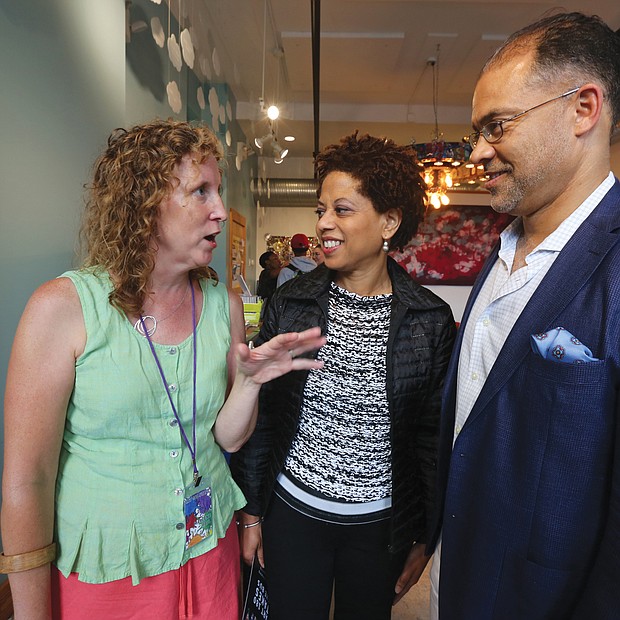 Marlene Paul, left, ART 180’s co-founder and executive director, greets Melody Barnes, former White House domestic policy adviser, and her husband, Marlon Buckner Jr., at the opening of ART180's 20th anniversary exhibit last Friday at the organization’s Atlas Galley, 114 W. Marshall St. Work from the exhibit, titled “Twenty: ART 180 Takes the Bus,” will spend most of August touring the city on GRTC buses.