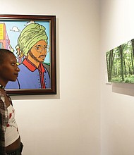 Cree takes in the artwork that she and 19 other program leaders at ART180 created to celebrate the nonprofit’s 20th year of giving young people from challenging circumstances an opportunity to express themselves through painting, sculpture, murals and other art. The anniversary exhibit opened last Friday at the organization’s Atlas Galley, 114 W. Marshall St. Work from the exhibit, titled “Twenty: ART 180 Takes the Bus,” will spend most of August touring the city on GRTC buses.