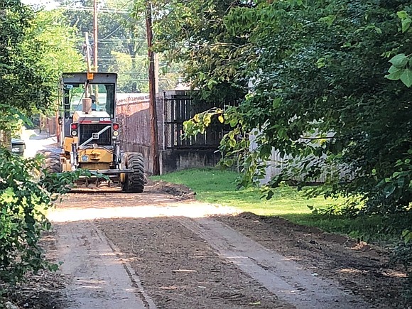 The roar of heavy equipment over a backyard fence signals the start of work on another alley. Suddenly, with little ...