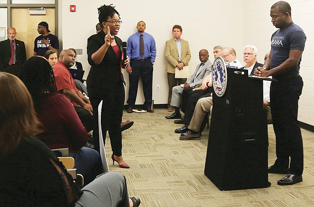 Princess Blanding, the sister of shooting victim Marcus-David Peters, confronts Mayor Levar M. Stoney at a July 26 community meeting about the death of her brother, who was shot by a Richmond Police officer on May 16. 