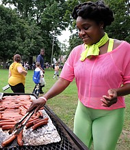 Hundreds of people across metro Richmond turned out Tuesday night for the 35th Annual National Night Out, an event observed across the country to promote safe neighborhoods while building police-community relations. McGruff the Crime Dog and the Richmond Police Department’s top brass and officers made the rounds at several of dozens of events put on by neighborhood and community groups across the city, including the one pictured here at Pollard Park in North Side. Felicia Joyner volunteers for grill duty.