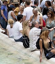Balancing tourism and overcrowding is a difficult act at The Trevi Fountain, one of Rome's most famous attractions.