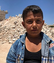 Ibrahim Dervish used to play right outside the ice cream shop with his friends who were killed in the airstrike. The shopkeeper would sometimes give them free ice cream. Ibrahim's favorite is mixed cherry and vanilla in a cone.
