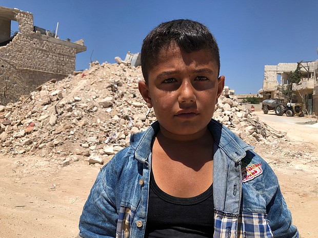 Ibrahim Dervish used to play right outside the ice cream shop with his friends who were killed in the airstrike. The shopkeeper would sometimes give them free ice cream. Ibrahim's favorite is mixed cherry and vanilla in a cone.