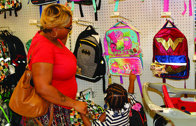 100 select students from Cook County School District 130 and Posen Robbins School District 143.5 received $100 each to buy anything and everything they needed including school supplies, backpacks, uniforms, and new shoes to start the school year off right. Photo Credit: Blue Island/Robbins Neighborhood Network