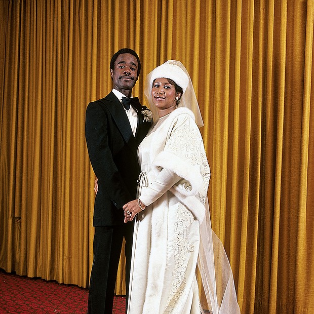 Aretha Franklin is photographed with her new husband, Glynn Turman, at their wedding in April of 1978. 