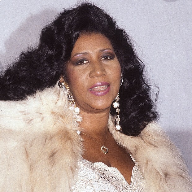 Ms. Franklin shows off the Grammy Legend Award she received during a ceremony Dec. 5, 1990, at the Theater Royale in New York.