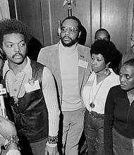 Ms. Franklin, second from right, stands with the Rev. Jesse Jackson Sr. as he speaks with reporters at the Operation PUSH Soul Picnic in March 1972 at the 142nd Street Armory in New York City. With them are, from left, Betty Shabazz, widow of Malcolm X; PUSH Vice President Tom Todd; South African singer Miriam Makeba; and Congressman Louis Stokes of Ohio.
