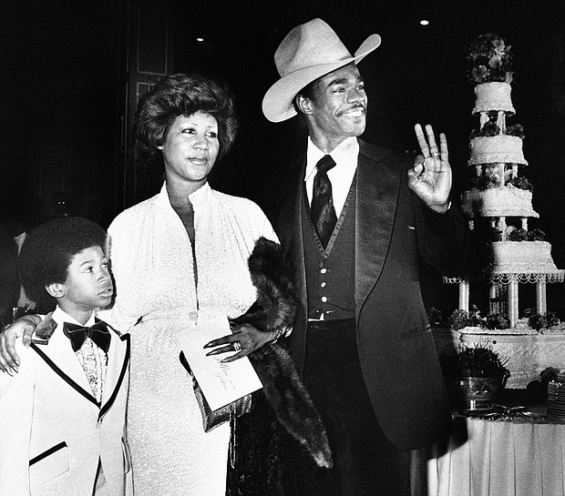 Ms. Franklin arrives at her Los Angeles hotel wedding reception with her new husband, actor Glynn Turman, and her 8-year-old son, Kecalf, on April 17, 1978.