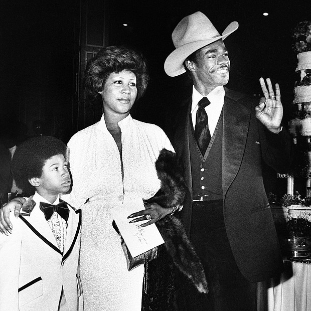 Ms. Franklin arrives at her Los Angeles hotel wedding reception with her new husband, actor Glynn Turman, and her 8-year-old son, Kecalf, on April 17, 1978.