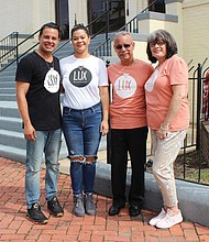 From left, Lux Church Pastor Victor I. “Manny” Peña and his wife, Christine, stand Sunday with Mr. Peña’s parents, Victor M. and Sonia Peña, outside the church’s new home on Leigh Street in Jackson Ward. 